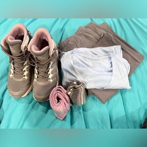 Women’s casual hiking outfit complete with shoes, shirt, pants and socks